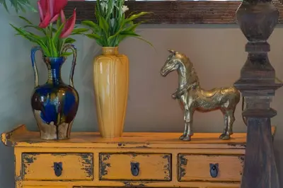 three vases and a statue of a horse on a dresser at Eshara 1 our Tropical & luxury 3BR Villa 450m from beach in Seminyak