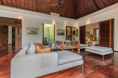 a living room with a couch and a table at Eshara 1 our Tropical & luxury 3BR Villa 450m from beach in Seminyak