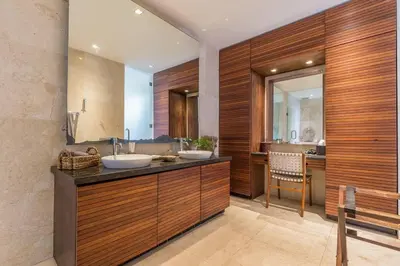 a bathroom with two sinks and a mirror at Eshara 3 our Peaceful 3BR Pool Villa close to Oberoi Beach in Seminyak