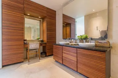 a bathroom with two sinks and a counter with a mirror at Eshara 23 an Amazing 5 BR Pool Villa walking distance to Beach in Seminyak