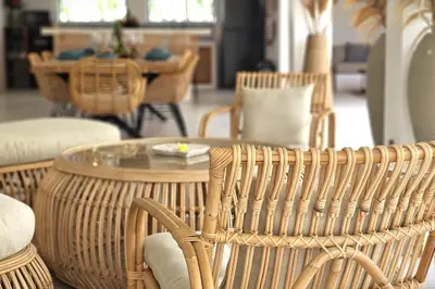 a room with wicker chairs and a glass table at Villa Kiara our Paradise in Seminyak 5 bedrooms 12m private pool in Seminyak