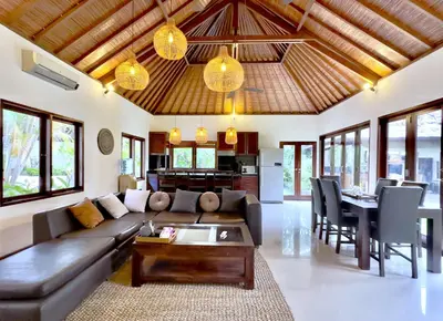 a living room with a couch and a table at An Amazing 6BDR Private Family Villa with Pool in Tanah Lot