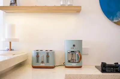 two toasters sitting on a counter in a kitchen at Magic Mango Villa Huge Projector bubble bath unique design in Canggu
