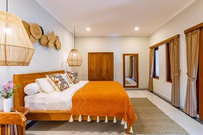 a bedroom with a bed in a room at Viona 3 Villa - 3 BDR villa, walk to the beach in Seminyak