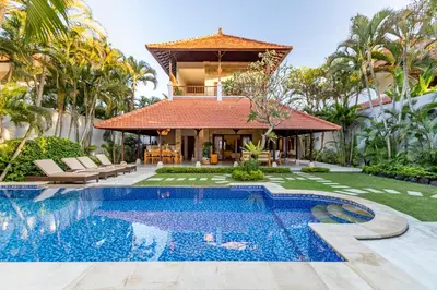 an exterior view of a villa with a swimming pool at Viona 3 Villa - 3 BDR villa, walk to the beach in Seminyak