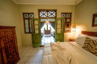 a bedroom with a bed with a bow on it at Villa CHANDI 1 - Legian-Seminyak - 8 Bedroom - 7 Bathroom Villa in Seminyak