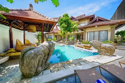 an exterior view of a villa with a swimming pool at Villa CHANDI 1 - Legian-Seminyak - 8 Bedroom - 7 Bathroom Villa in Seminyak