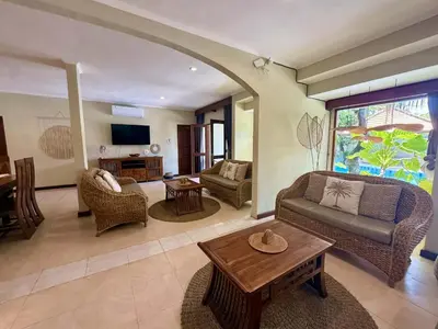 a living room with a couch and a table at Villa CHANDI 1 - Legian-Seminyak - 8 Bedroom - 7 Bathroom Villa in Seminyak