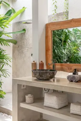 a bathroom with a sink and a mirror at Villa Cempaka Ungu - Tranquil & Chic Pool 4-Bedroom Villa In The Heart Of Seminyak in Seminyak