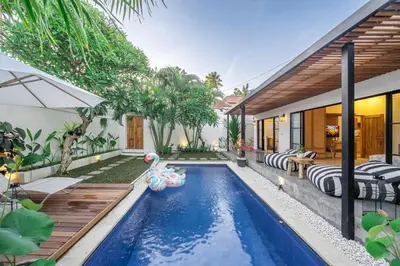 a swimming pool in the backyard of a house at Kalya Villa by RPM in Seminyak