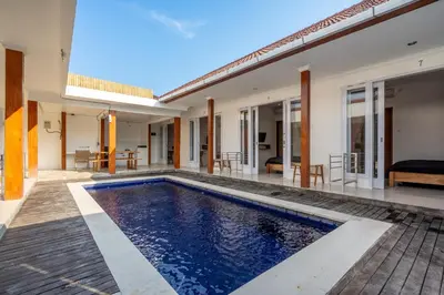 a pool in the backyard of a villa at Lumturi House - Centrally Located in Seminyak
