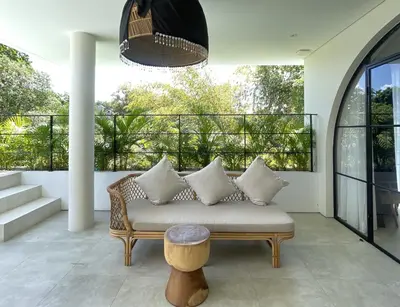 a living room with a couch and a table at Villa Anwa Cove - Gorgeous 6-BR & 2-Pool Villa in Bali in Umalas