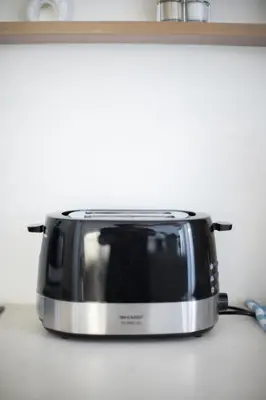a black and silver toaster sitting on a kitchen counter at Casa Z - Seminyak 3BR Villa with Private Pool in Seminyak