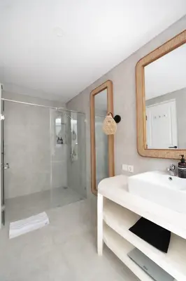a bathroom with a sink and a shower at Casa Z - Seminyak 3BR Villa with Private Pool in Seminyak