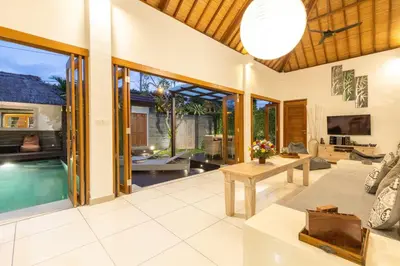 an open living room with a pool and a villa at Luxurious Double King Villa w/Pool & WiFi+ Carpark in Seminyak