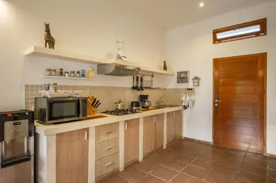 a kitchen with a microwave and a counter top at 2 Br Villa in Seminyak with private Pool and Parking in Seminyak