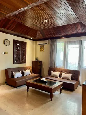 a living room with two couches and a coffee table at Galayanee’s Resort Apartment in Seminyak