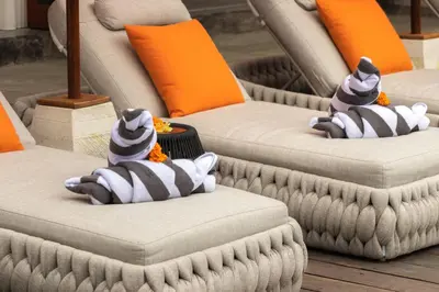 a group of couches with stuffed animals on them at Villa Mahkota Seminyak in Seminyak