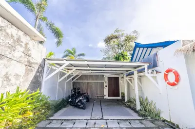 a motorcycle parked in front of a garage at Enclose living 5Br Villa Center of Seminyak Near Beach in Seminyak