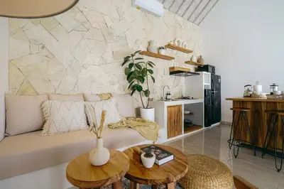 a living room with a couch and a table at Villa Aarka - Chic Balinese Bohemian Retreat in Seminyak in Seminyak