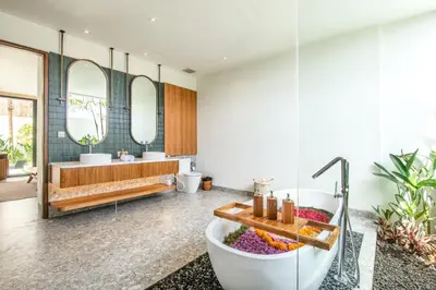 a bathroom with a tub and a sink at Brand new Luxury 5 br villa 200m to Brawah Beach in Canggu