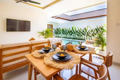 a dining room with a table and chairs at Balibay 1 - Private Villa with Pool in Canggu in Kerobokan