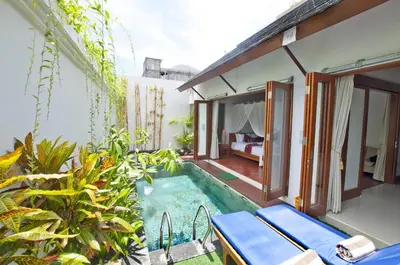 an outdoor swimming pool in a villa at Villa Bougainville in Seminyak