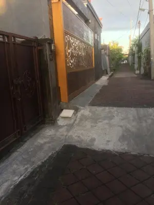 an empty alley with a door and a building at Simple apartment 1 Number 146 c in Seminyak