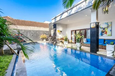 a swimming pool in the backyard of a house at Alex Villas Coco - Seminyak in Seminyak