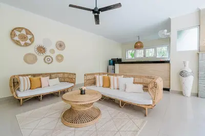 a living room with two couches and a table at Villa Melati - Seminyak in Seminyak