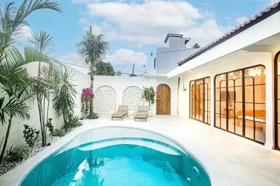 a pool in the backyard of a house at Villa Lemone 3 by Bali Villa Solutions in Seminyak
