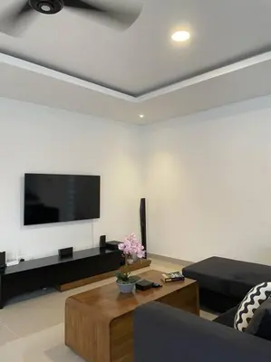 a living room with a couch and a tv at Villa Akmali Umalas 2BR with Private Pool & Jacuzzi in Canggu