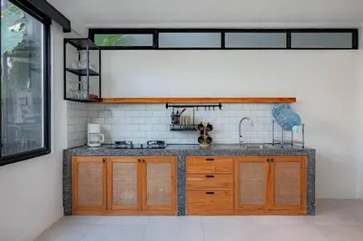 a kitchen with a sink and a counter top at Town House CAMY in Seminyak
