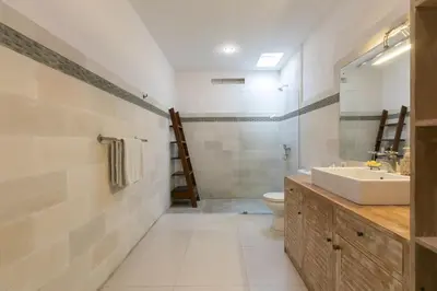 a bathroom with a sink and a toilet at Villa Briana Seminyak by Villas R Us in Seminyak