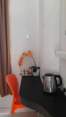 a table with a tea kettle on top of it at The Agung Residence in Seminyak