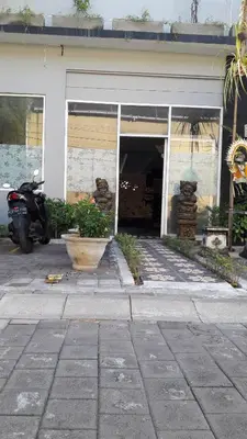 a motorcycle parked in front of a building at The Agung Residence in Seminyak