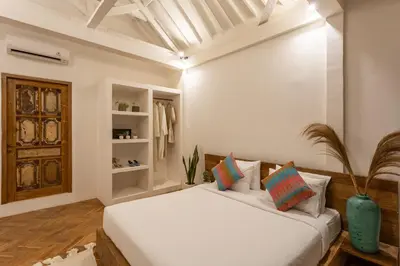a white bedroom with a bed in a room at 2 BDR villa, walking distance to Seminyak beach. in Seminyak