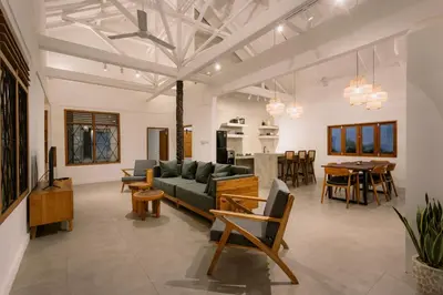 a living room with a couch and a table at Villa Batu Putih Seminyak in Seminyak