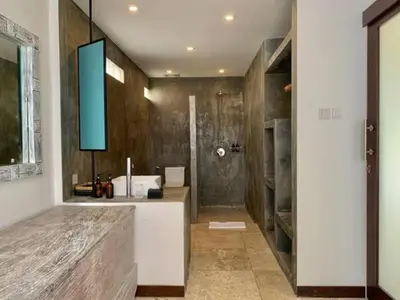a bathroom with a sink and a shower at Alami Apartment Seminyak in Seminyak