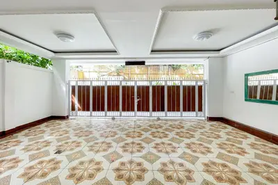 an empty room with a gate and a tile floor at RedDoorz at Lotus House Seminyak in Seminyak