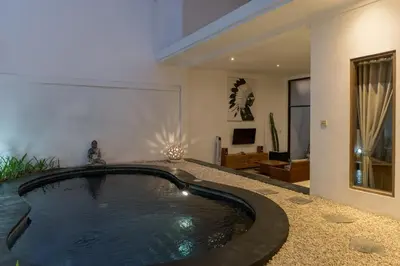 a hot tub in the middle of a living room at Villa Skyler Seminyak in Seminyak