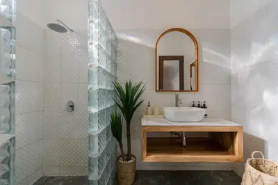 a bathroom with a sink and a shower at Villa Skyler Seminyak in Seminyak