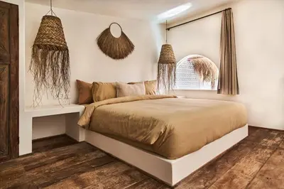 a bedroom with a large bed and a window at Gorgeous Mediterranean Style 2 Bed, Top Pick! in Canggu