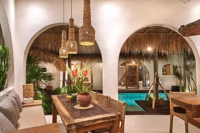 a living room with a table and a pool at Gorgeous Mediterranean Style 2 Bed, Top Pick! in Canggu