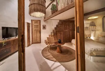 a bedroom with a staircase and a bed and a table at Gorgeous Mediterranean Style 2 Bed, Top Pick! in Canggu