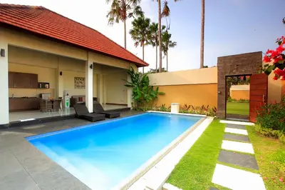 a swimming pool in the backyard of a house at 1 Bed Room Villa In Seminyak in Seminyak