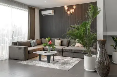 a living room with a couch and a table at Premier Umalas Villas in Seminyak