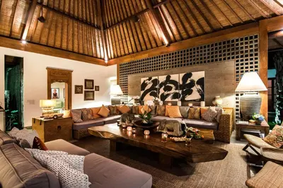 a living room with couches and a coffee table at Villa Tiga Puluh, 7 Bedrooms Private Villa in Seminyak in Seminyak