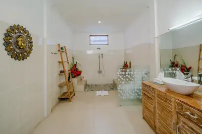 a bathroom with a sink and a mirror at Villa Alleira - 5 Bedroom Villa in Centre Location of Seminyak in Seminyak