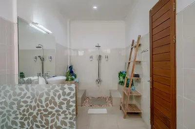 a bathroom with a shower and a toilet and a sink at Villa Alleira - 5 Bedroom Villa in Centre Location of Seminyak in Seminyak